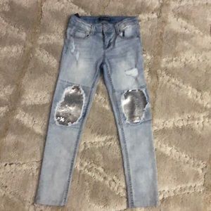 Distressed with a pop of sequins faded wash jeans
